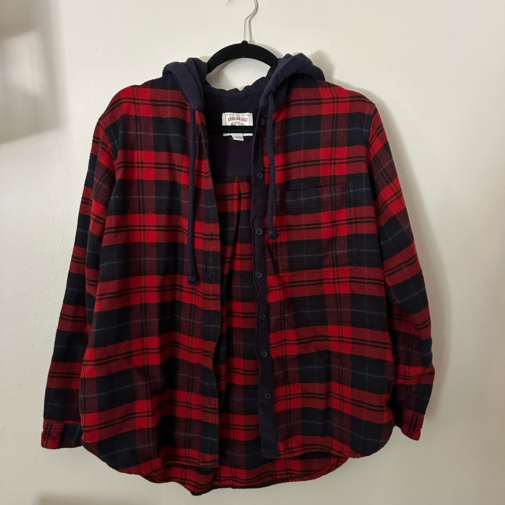 Flannel button up. Can be worn as shirt or jacket. Hoody and front pocket.
